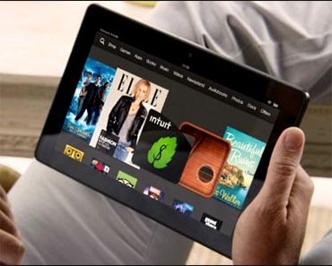 Amazon Kindle Fire Giveaway image shows a person using an Amazon Kindle Fire 8 in their hand.