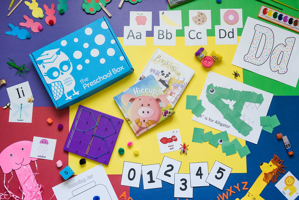 Images of abc and 123 cards and crafts that are often found inside of the preschool box.