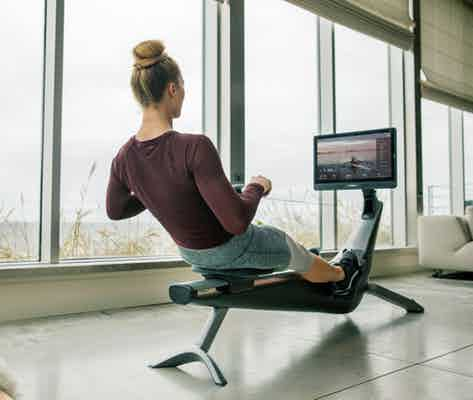 lady working out on hydrow home rowing machine 